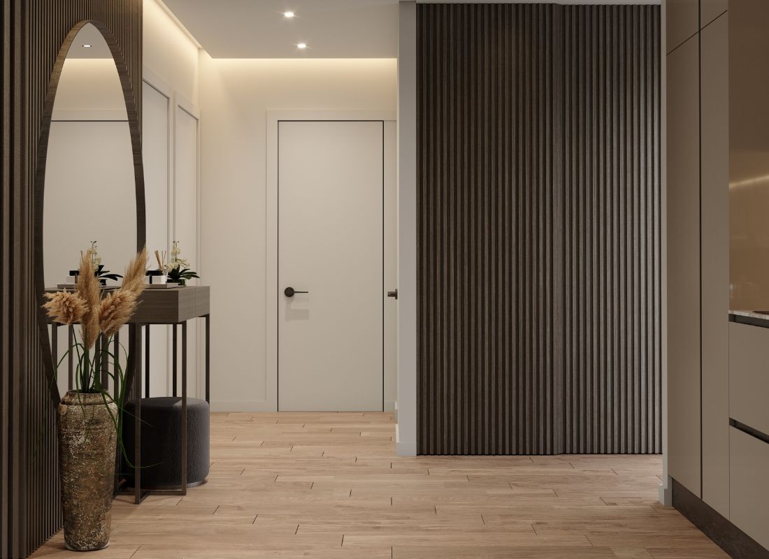 prikaz elegantno sređenog hodnika sa velikim ogledalom i drvenim lajsnama